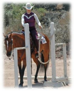 Melissa doing a trail course with her horse Lacey